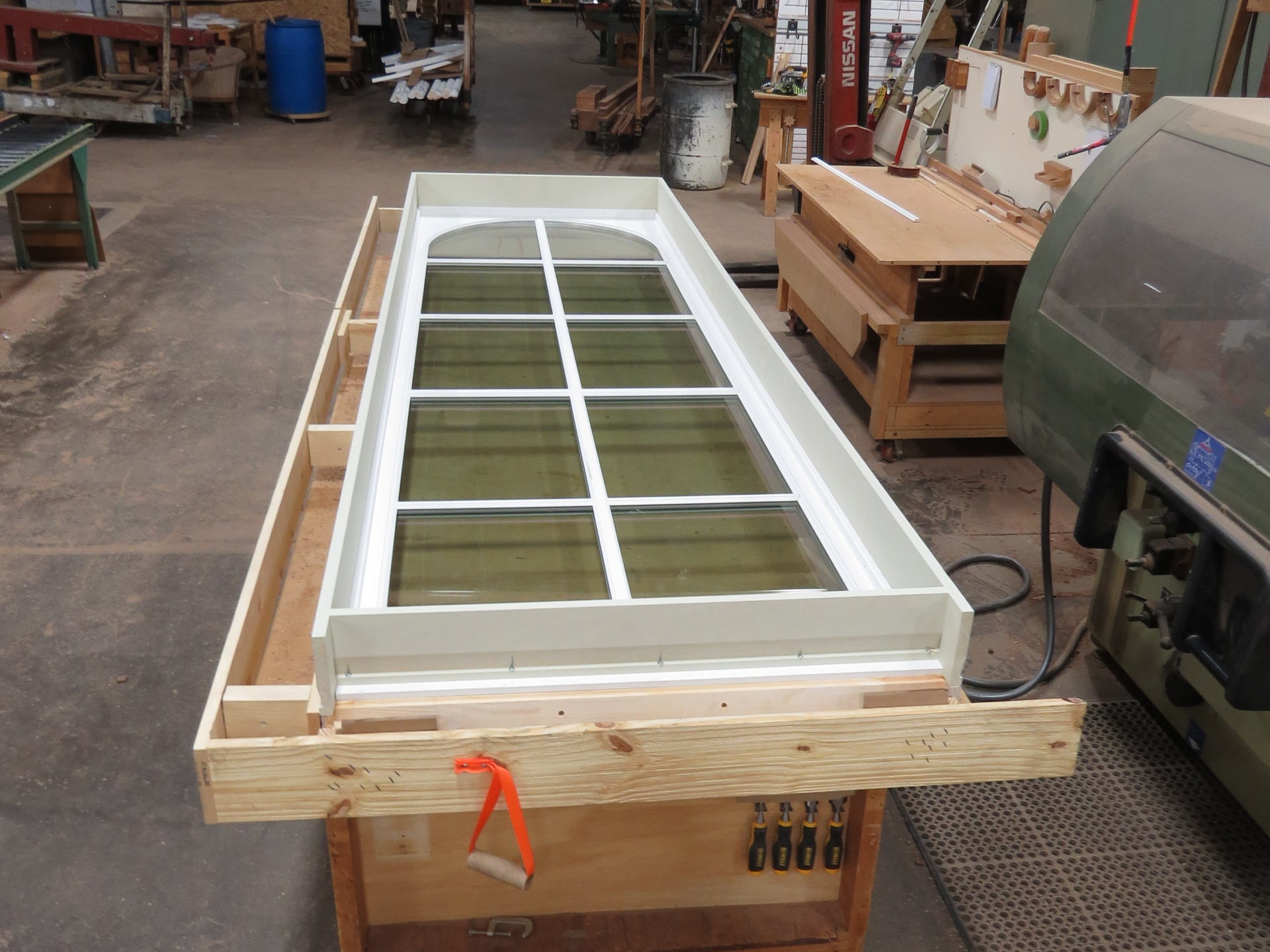 Single fixed window in frame with half round top with lites