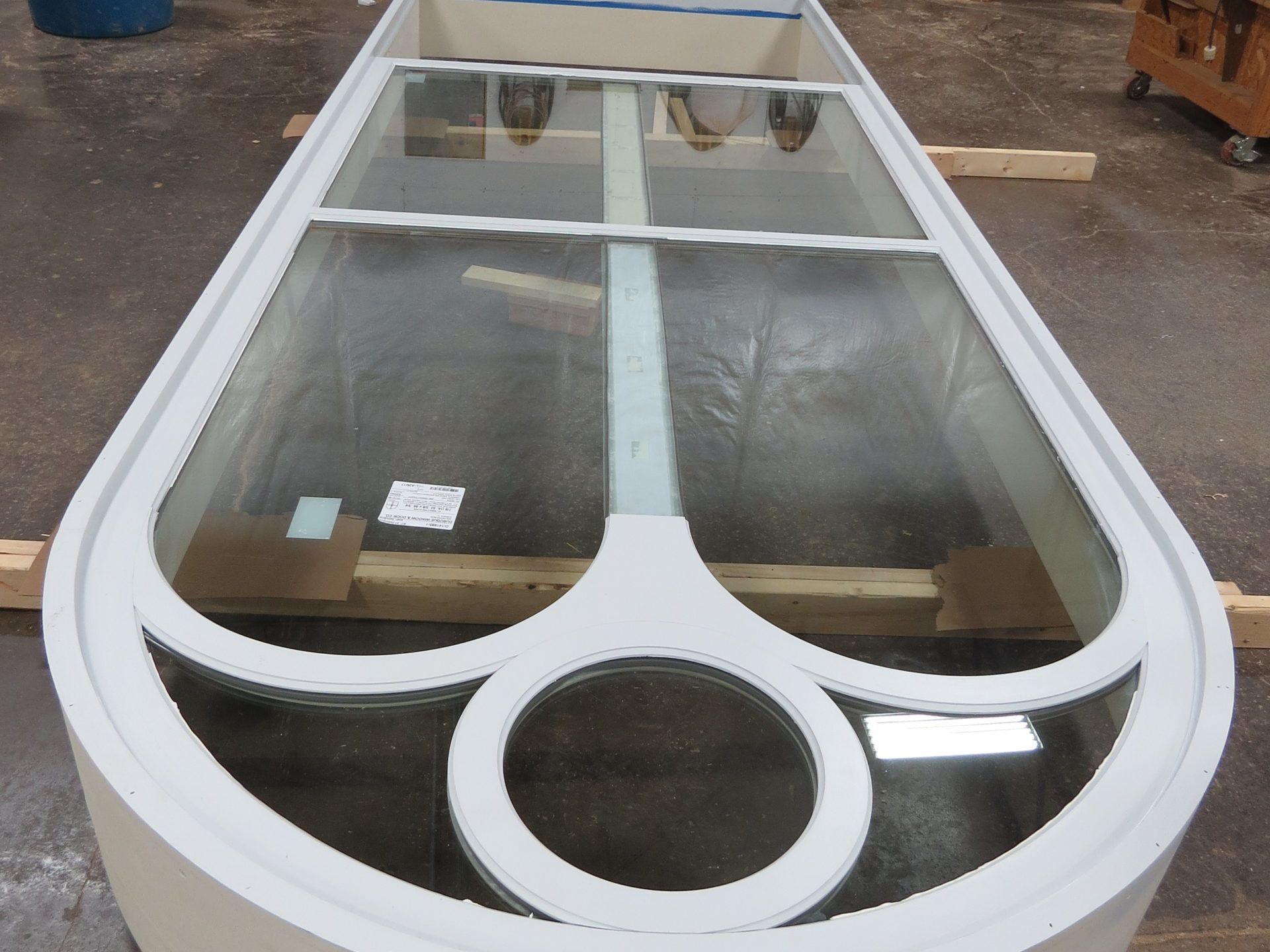 Single hung batwing fixed window in frame