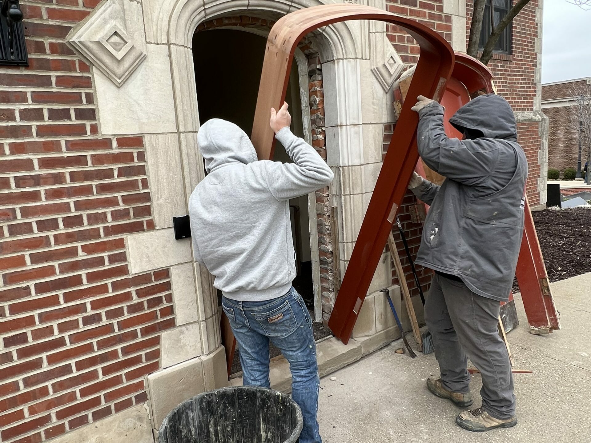 Placing University Radius Top Door Frame into Brick & Stone Opening