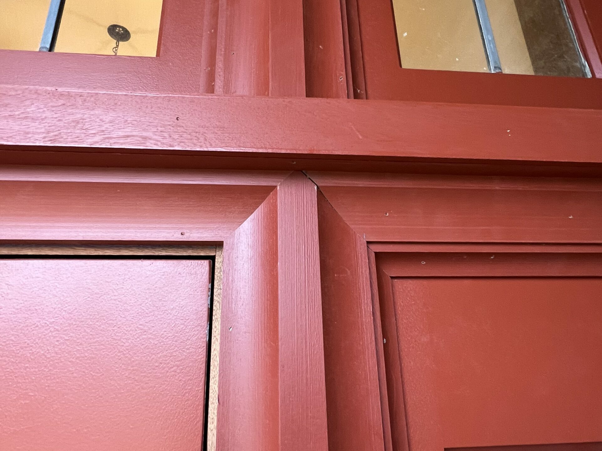 Close-up of Installed Mull Cover on University Entry Transom, Door, and Sidelite